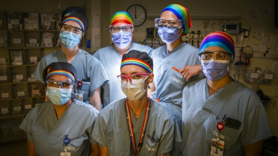 the Emergency Department team wearing their pride scrub caps
