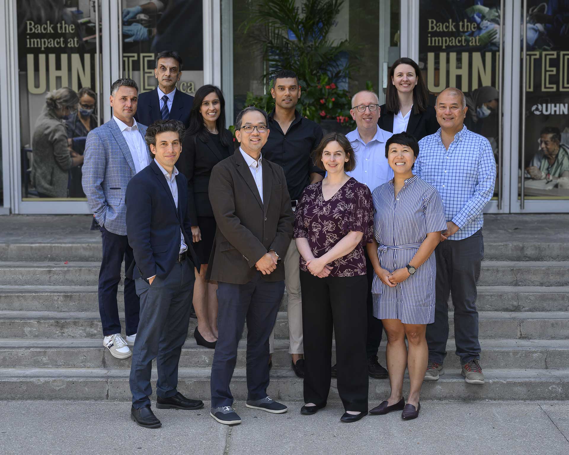 UHN Liver program team, posing for a photo, outside of Toronto General Hospital.