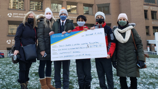 Student-run walkathon raises thousands to support UHN (image: students from Northmount present cheque at Toronto General Hospital)