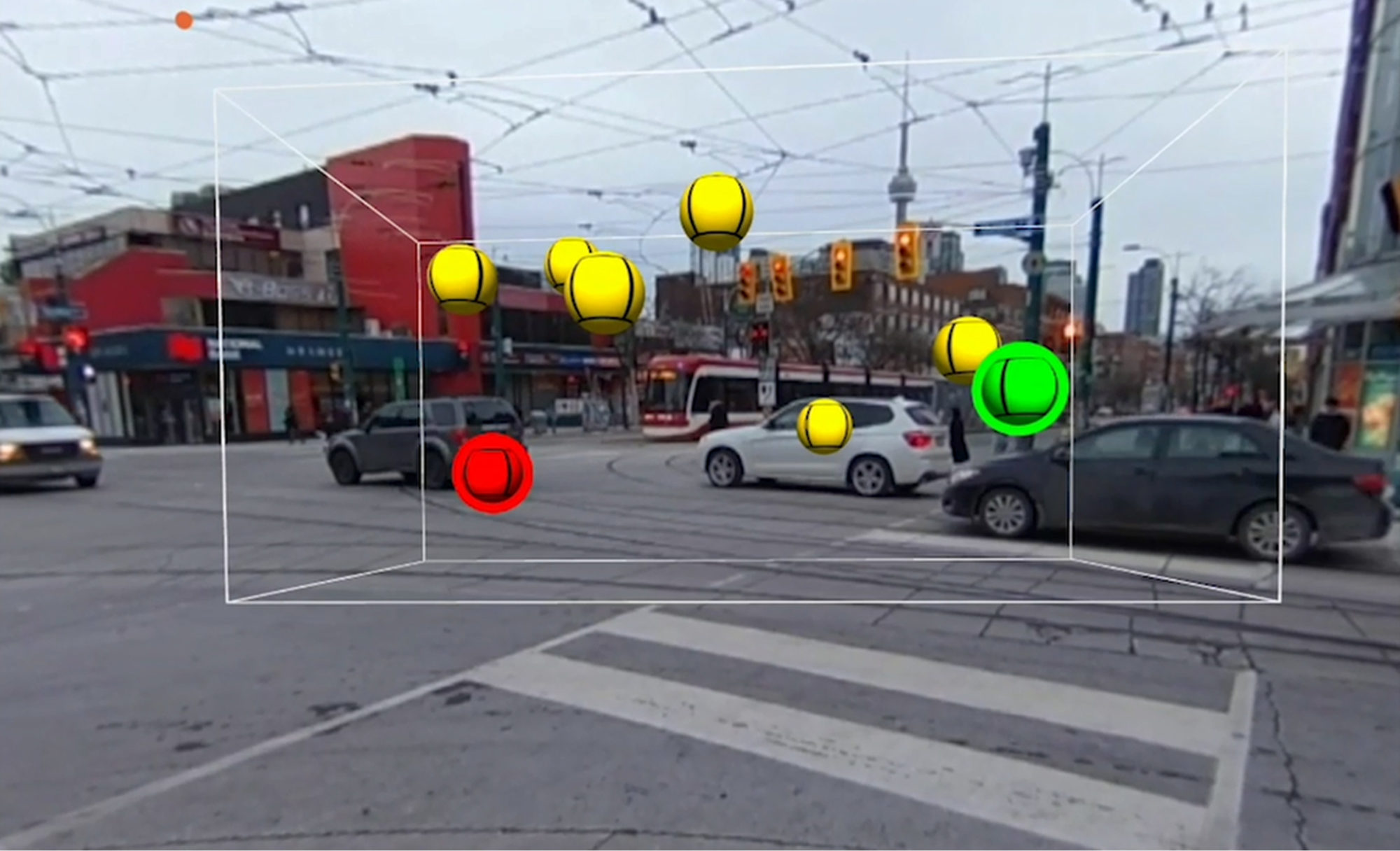 Virtual reality headset image of Toronto with digital square and yellow and green balls in the centre.