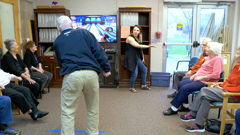 Participants enjoy Kinect Bowling in a group-based activity.