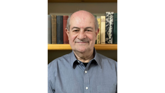 Dr. Bernstein in front of books