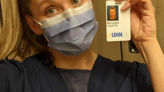 Meighen Coutts holding her UHN badge