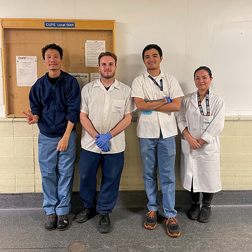 (L to R), Nutrition porters Tenzin Palden, Dylan Macclelland, Agassi Herrera, and Nutrition supervisor Ruri Suzuki, stayed late over Thanksgiving weekend when an issue arose with a refrigerator. Together, they moved several loads of patient food to a backup freezer truck to ensure food safety. (Photo: UHN)