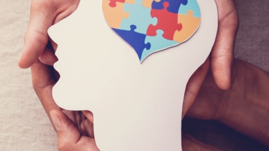 Mental health image with puzzle pieces in the shape of a heart