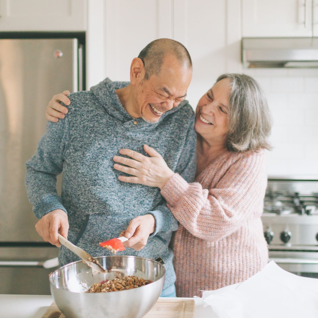 A couple in a kitchen making diabetes-friendly recipes