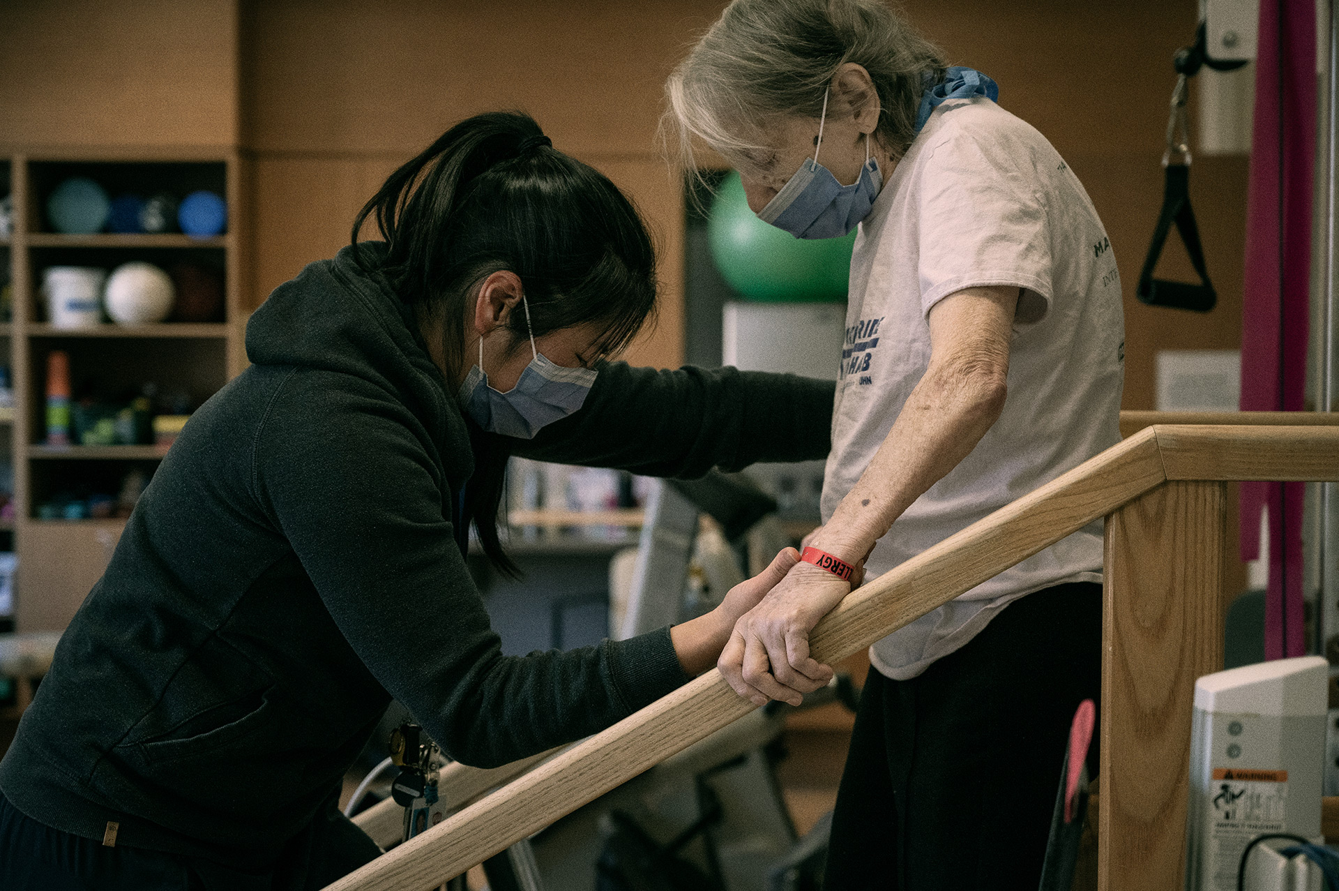 A patient at Toronto Rehab working with physiotherapist Vanessa Ong on safely maneuvering stairs.