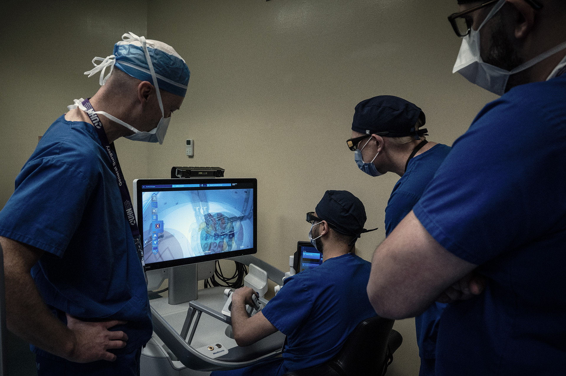The surgical team learning how to control one of the surgical robots.