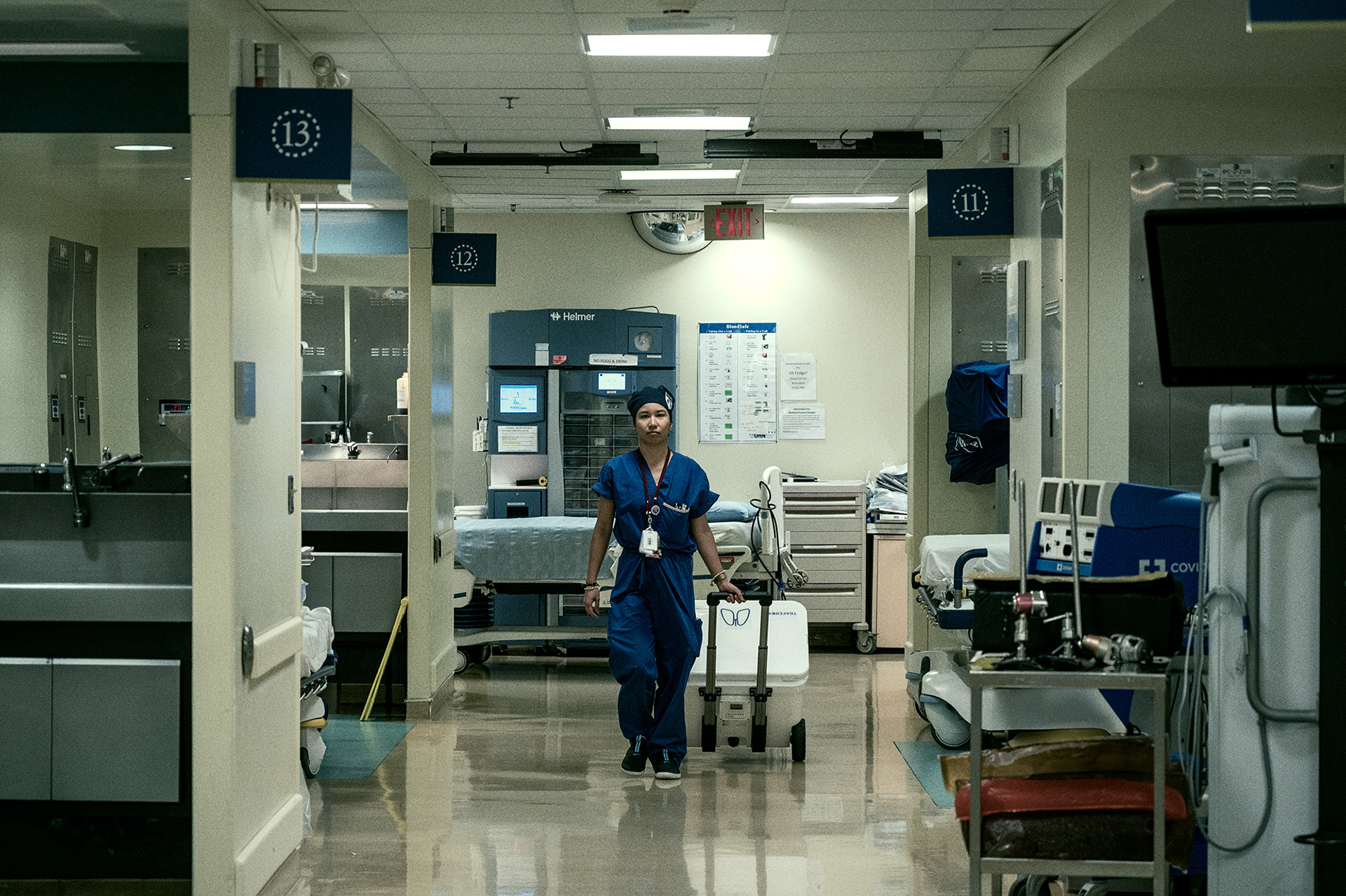 Nurse walking down a hallway at Toronto General Hospital.