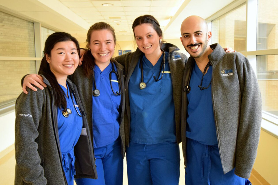 ​(L to R) Evelyn Ng, Gabriella Giddey, Ashley Barton and Raymond Khanano are physician assistants in General Internal Medicine at Toronto General Hospital. They are among a group of GIM health care professionals driving change in patient care. (Photo: UHN)