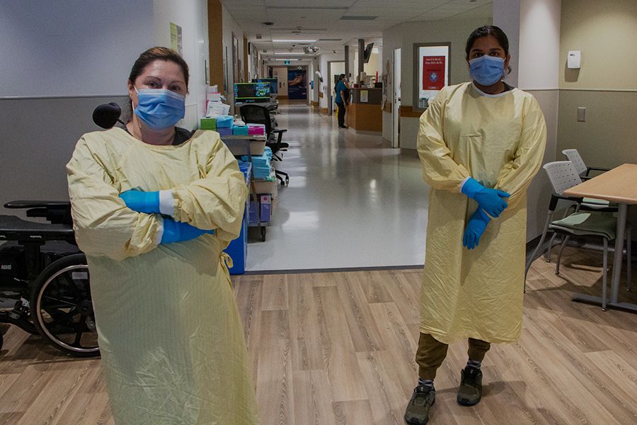 Rosa Carolo (L), a cleaner at Toronto Rehab, Lyndhurst Centre, and Shahithra Ramesh, a registered practical nurse