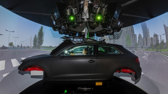 A patient driving in a simulation at KITE