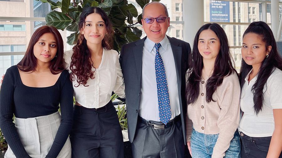 Amanpreet Jolly worked with classmates at Ontario Tech University to co-author and illustrate the book. The team visited UHN. (L to R), Shavini Karunaratne, Amanpreet Jolly, Dr. Yau, Dilothi Selvarajah and Shabana Azizi. (Photo: Courtesy Amanpreet Jolly)