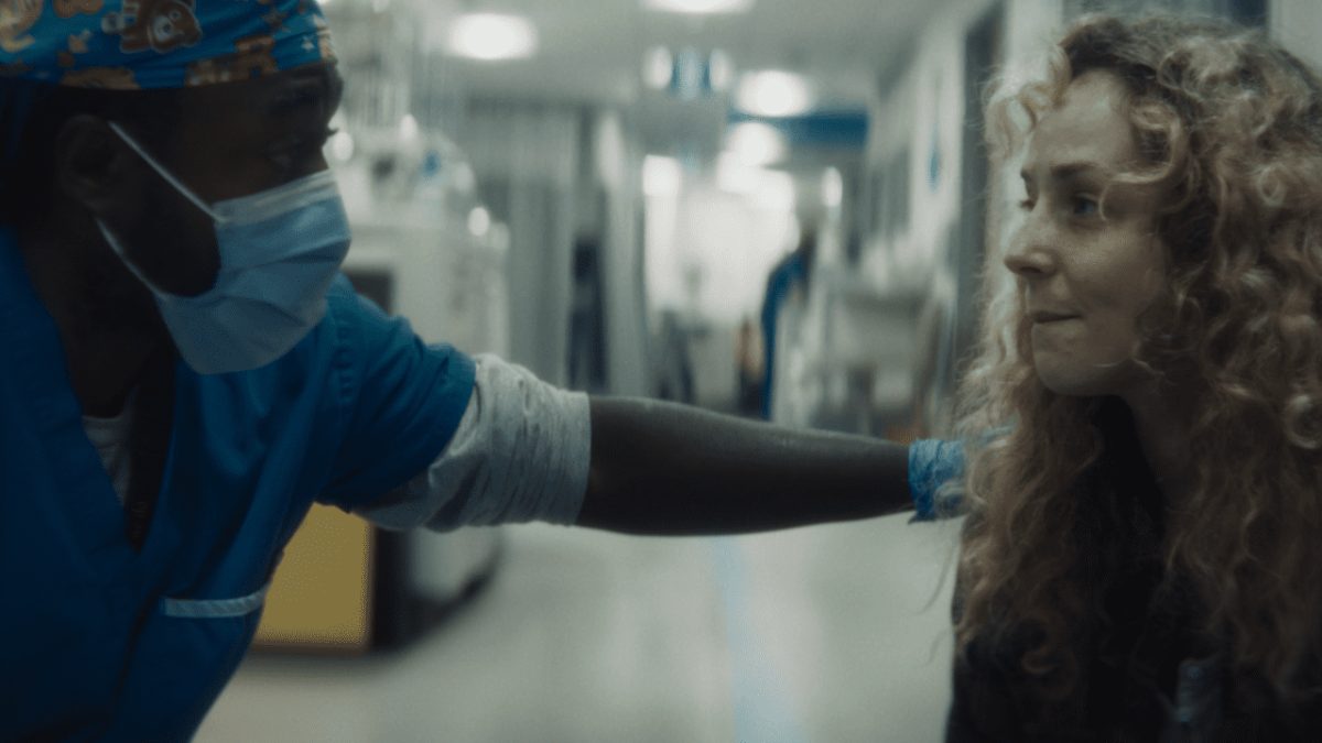 A peer support worker at UHN helping a patient