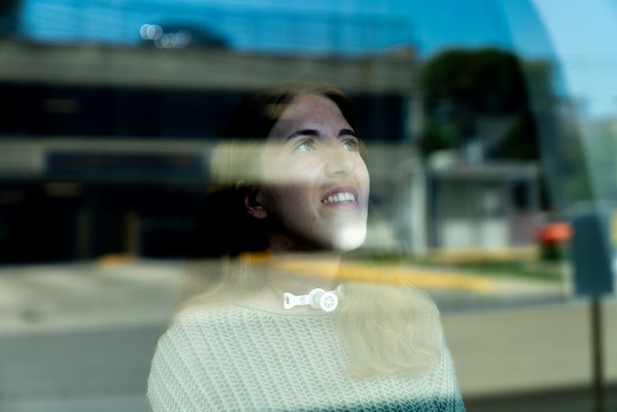 Liana Hart looking out a window at UHN.