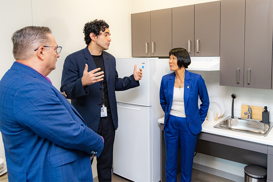 On a tour of one of the 51 units at Dunn House, Dr. Andrew Boozary, Executive Director of UHN's Gattuso Centre for Social Medicine, (C), makes a point to Toronto Mayor Olivia Chow and Keith Hambly, CEO of Fred Victor. (Photo: UHN)