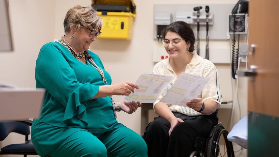 ​​​​Dr. Cathy Craven with a patient at Toronto Rehab