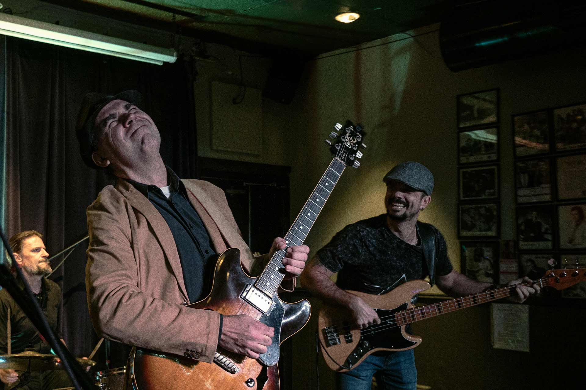 A grateful patient plays guitar on stage with his band.