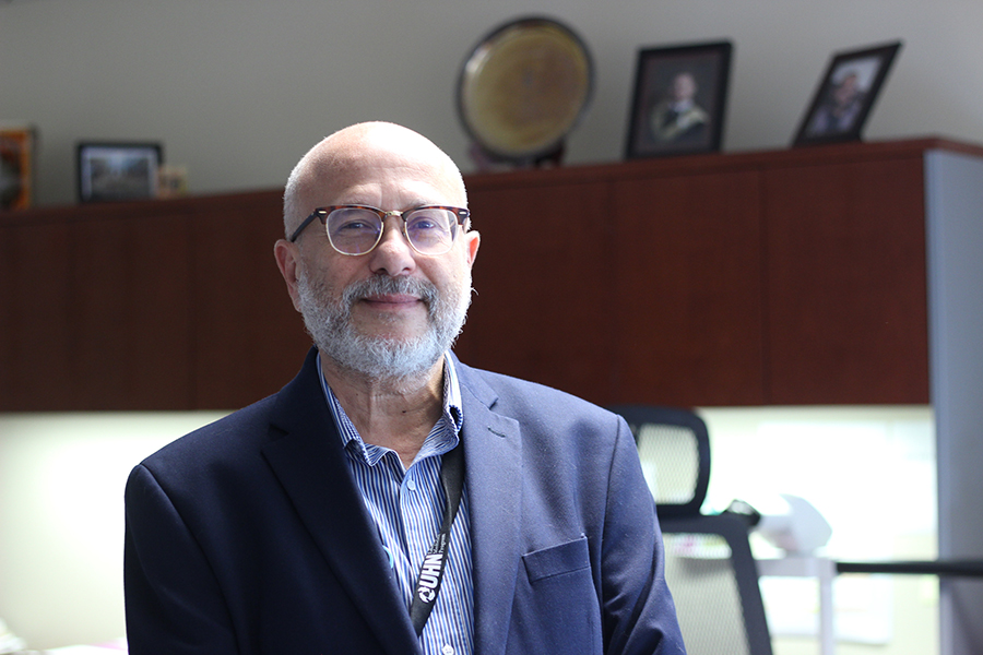 Dr. George Yousef, Medical Director of UHN's Laboratory Medicine Program standing in his office at UHN.