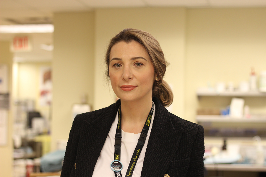 Dr. Klaudia Nowak at UHN wearing a UHNITED lanyard.