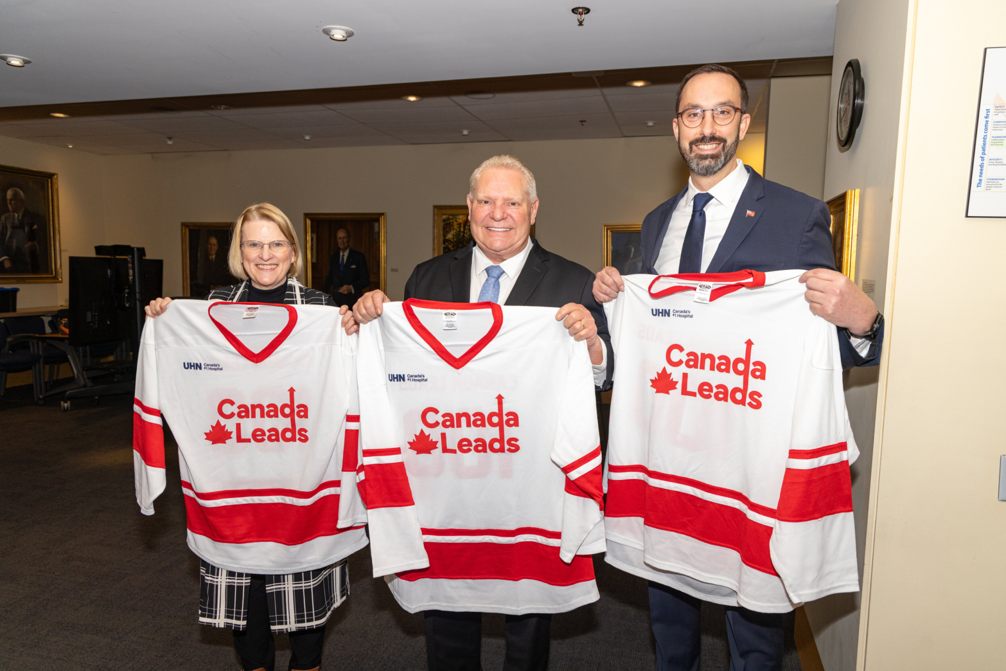 Doug Ford, Sylvia Jones, and Nolan Quinn with jerseys