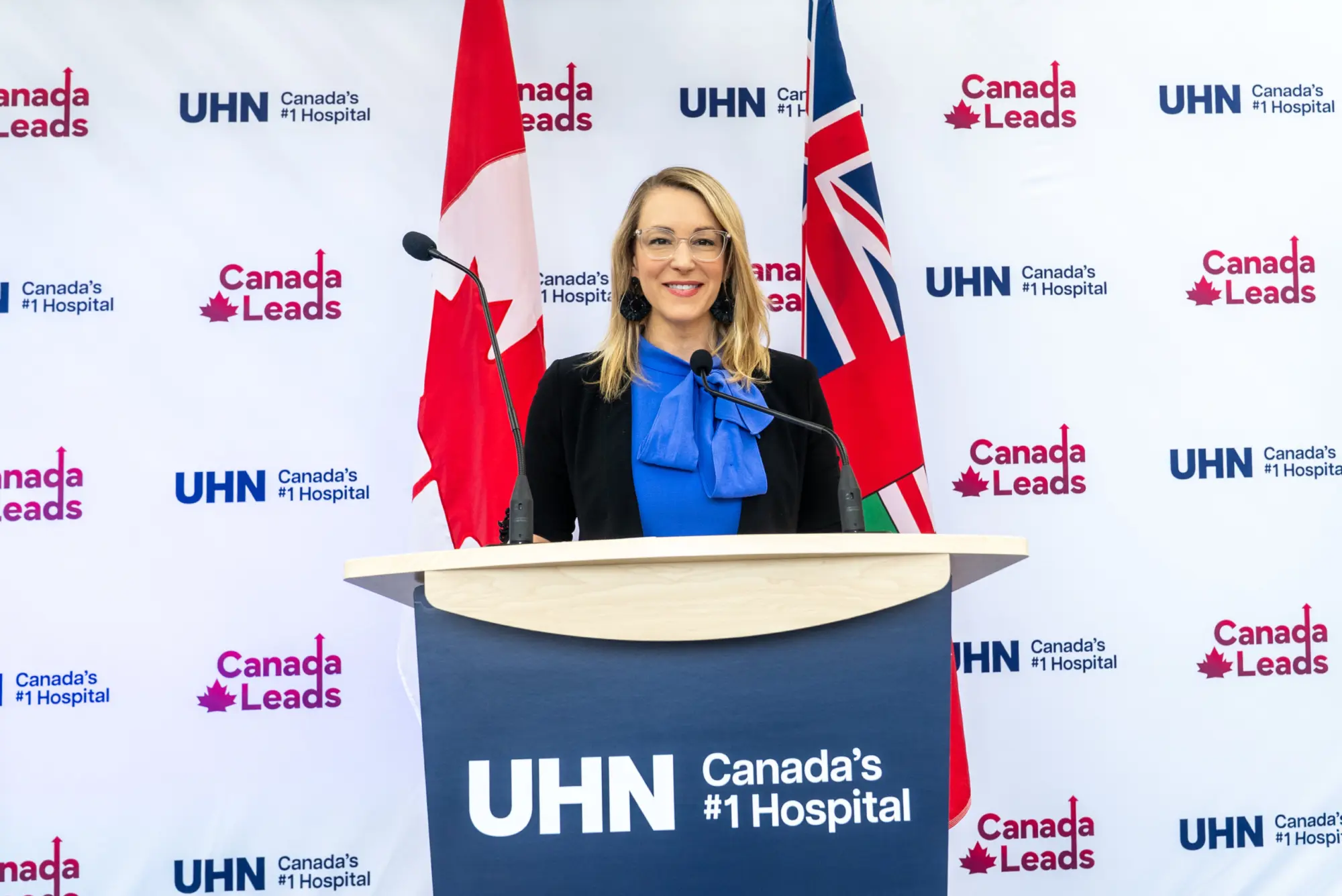 Julie Quenneville at a podium