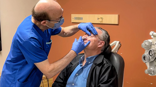 Dr. Stephen Kraft with a patient