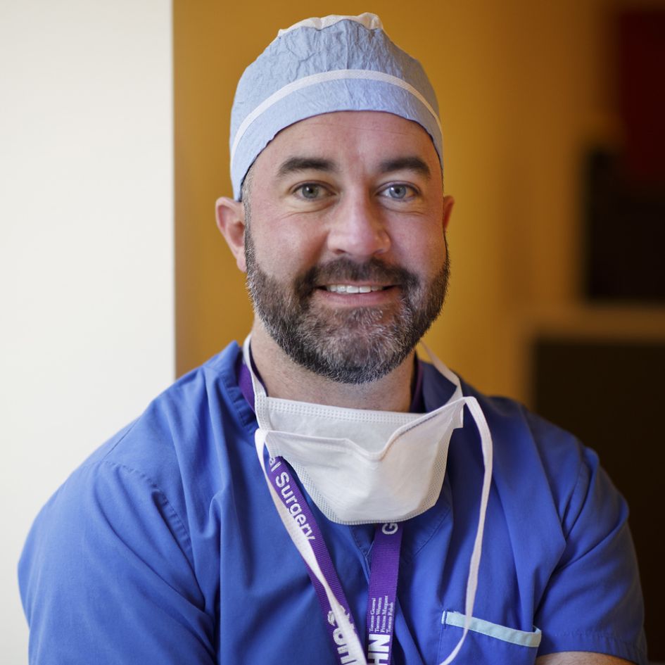 Dr. Tim Jackson in scrubs at UHN