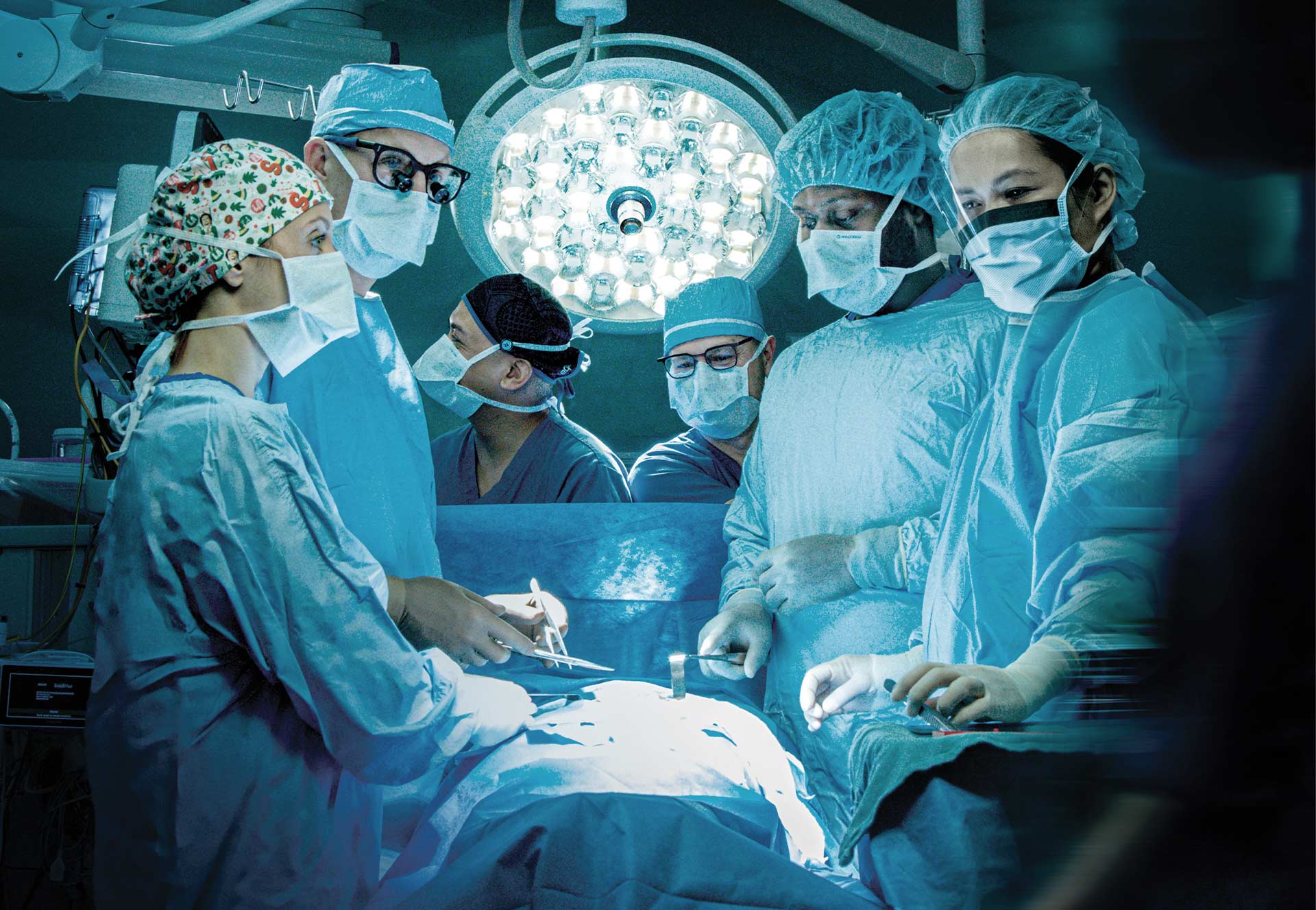 A group of surgeons in an operating room.