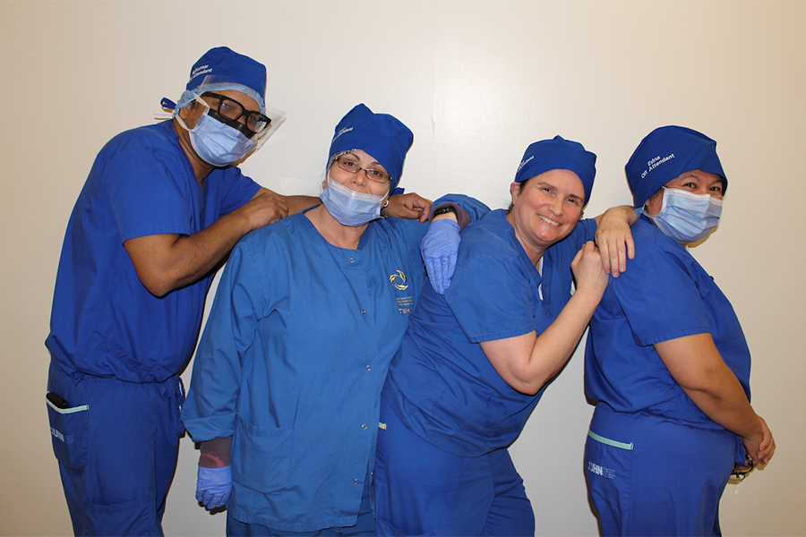 Operating room staff at UHN's Toronto Western Hospital wearing the new caps, (L to R), Rajkumar Arunasalam, Lucy Policaro, Ana Moco, Edna Deonoso. (Photo: UHN)