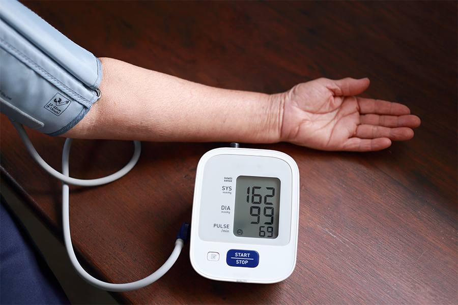 Blood pressure monitor on an arm.