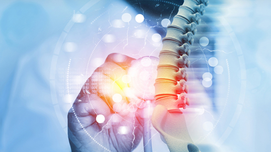 A spinal cord graphic with digital glass and a light shining through