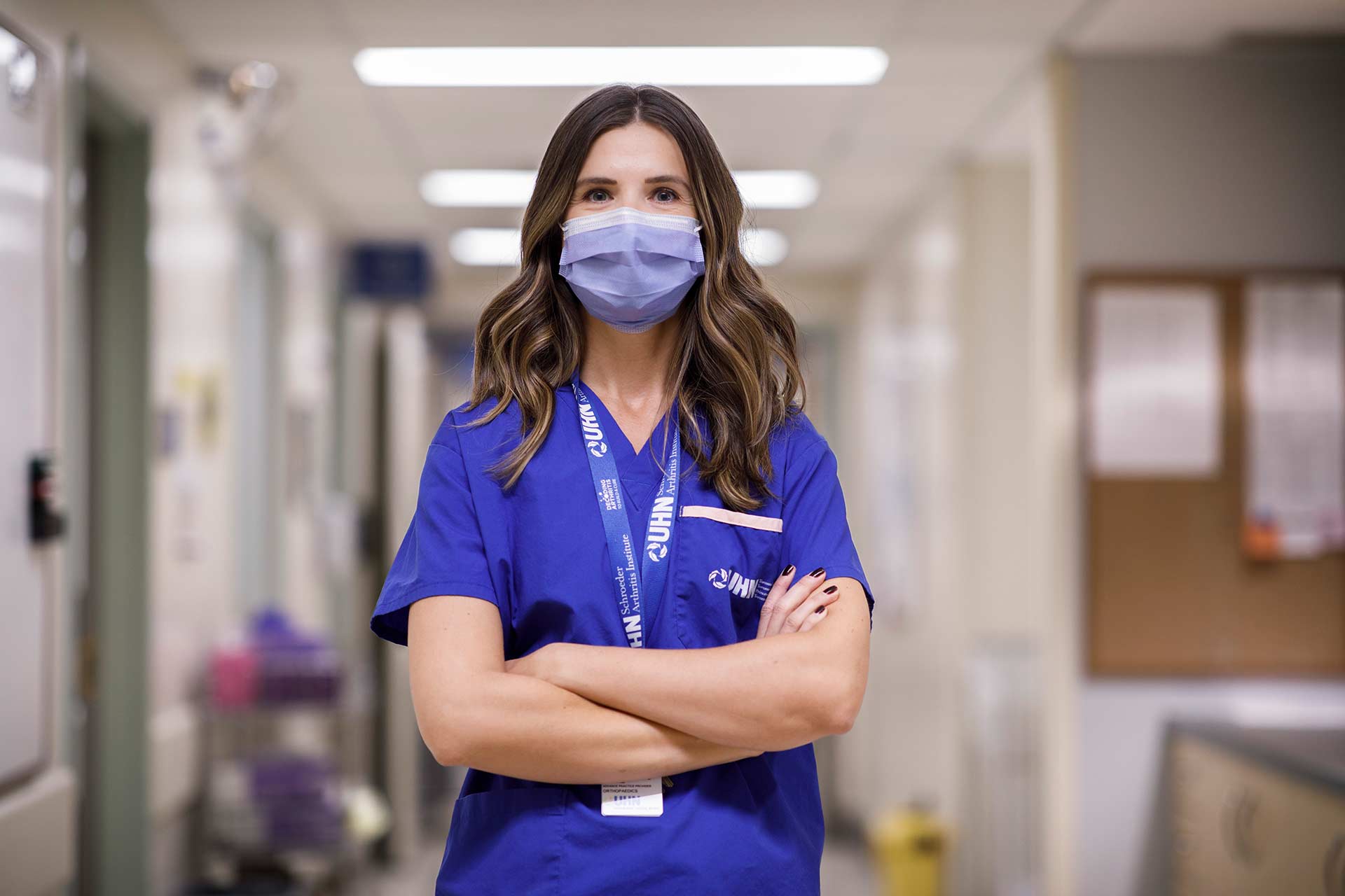 UHN healthcare worker wearing a mask and looking into the camera