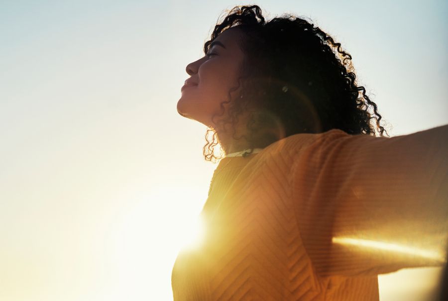 A woman enjoying the sunshine and fresh air. (Photo: iStock)