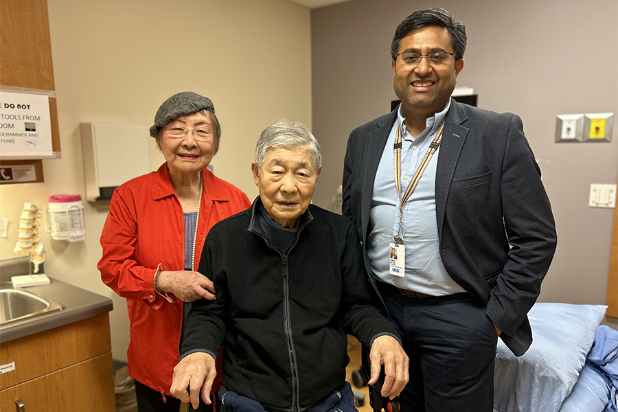 Joyce Lee, Mike Lee, and Dr. Nimish Mittal in a patient room at Toronto Rehab.