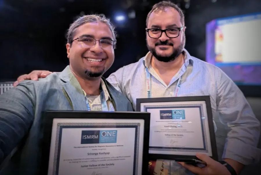Dr. Kamil Uludag with an award.