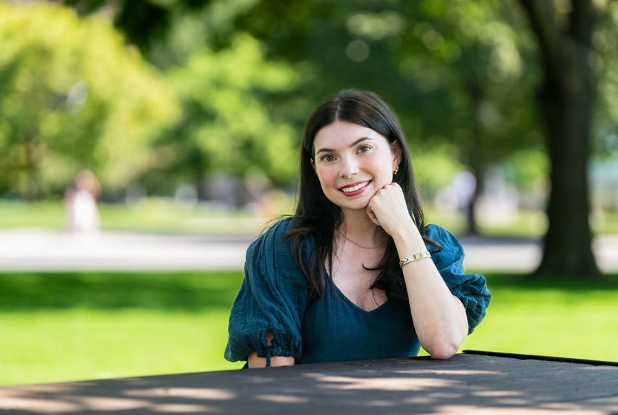 Macenzie Rebelo outside at  a park in the summer.