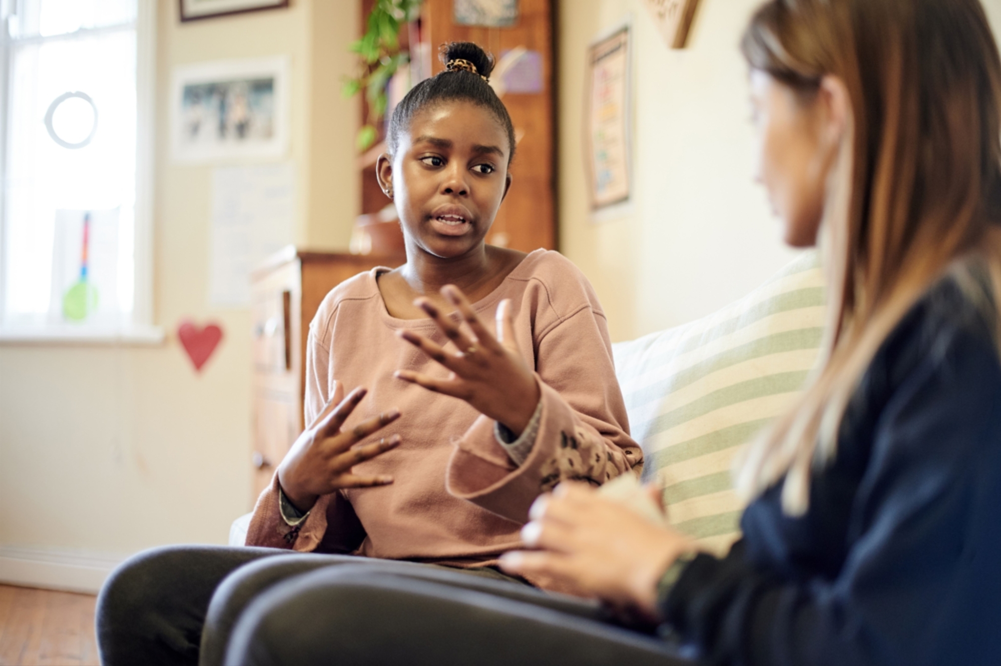 Two women sitting talking