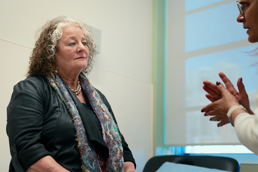 Pauline Andrea listening during a conversation while at UHN.