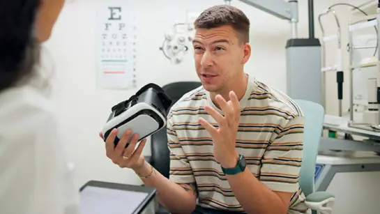 A stock image of a patient holding VR in a clinical setting.