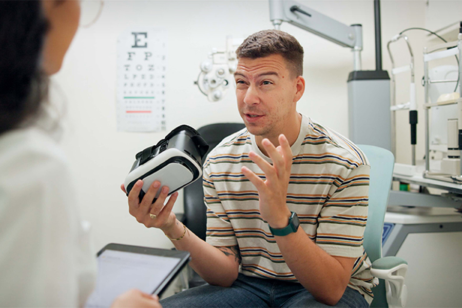 A stock image of a patient holding VR in a clinical setting.