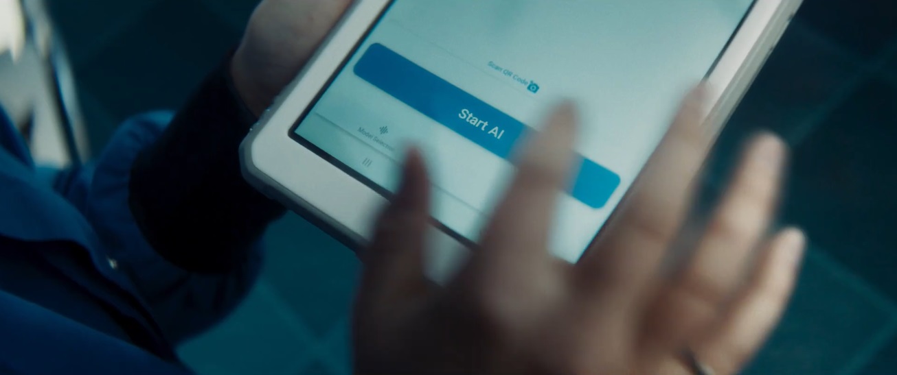 Button on iPad that reads: Start AI. 