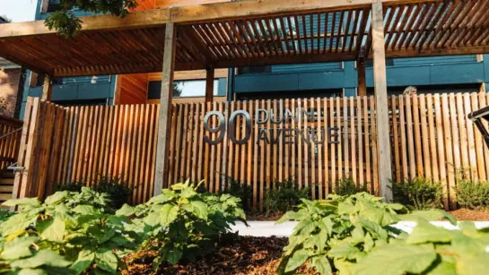 Outside Dunn House with flowers on a sunny day.