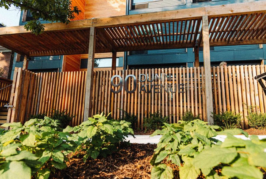 Outside Dunn House with flowers on a sunny day.