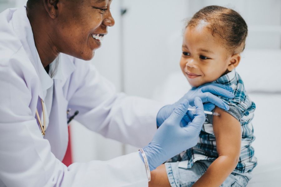 A doctor giving the measles vaccine