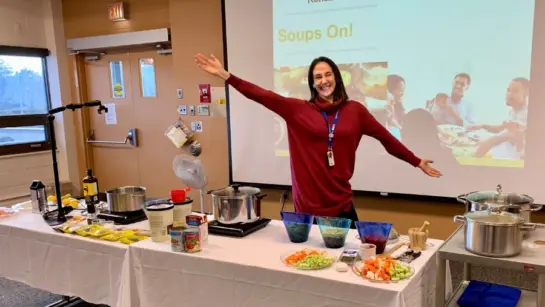 Staff at Toronto Rehab hosting a cooking class with ingredients and a power point with instructions.