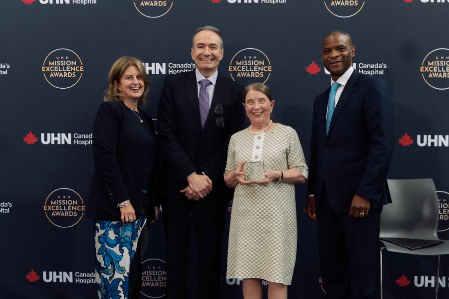 Dr. Frances Shepherd holding her award with UHN leadership.