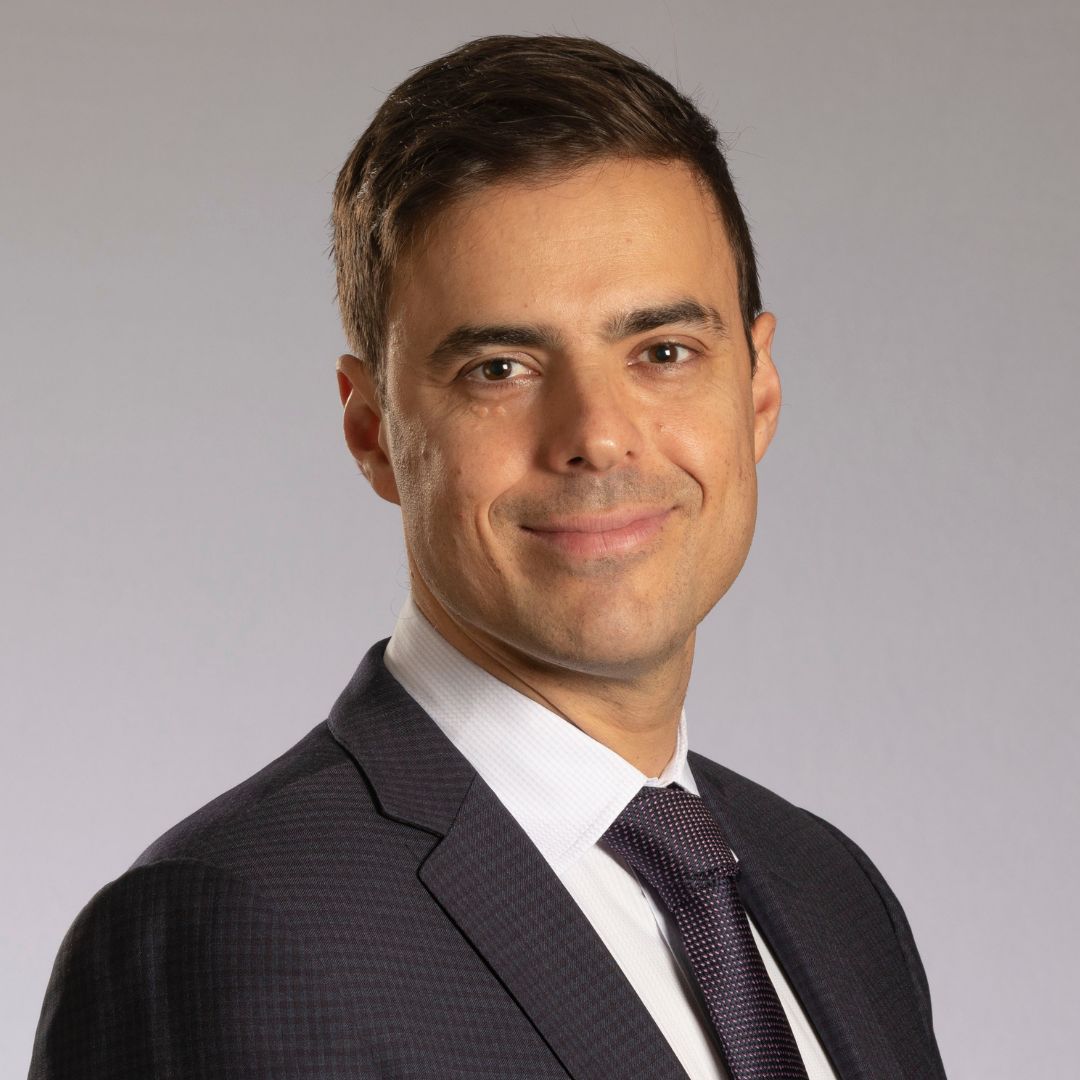 Dr. Aristotle Voineskos wearing a suit and smiling for a portrait photo.