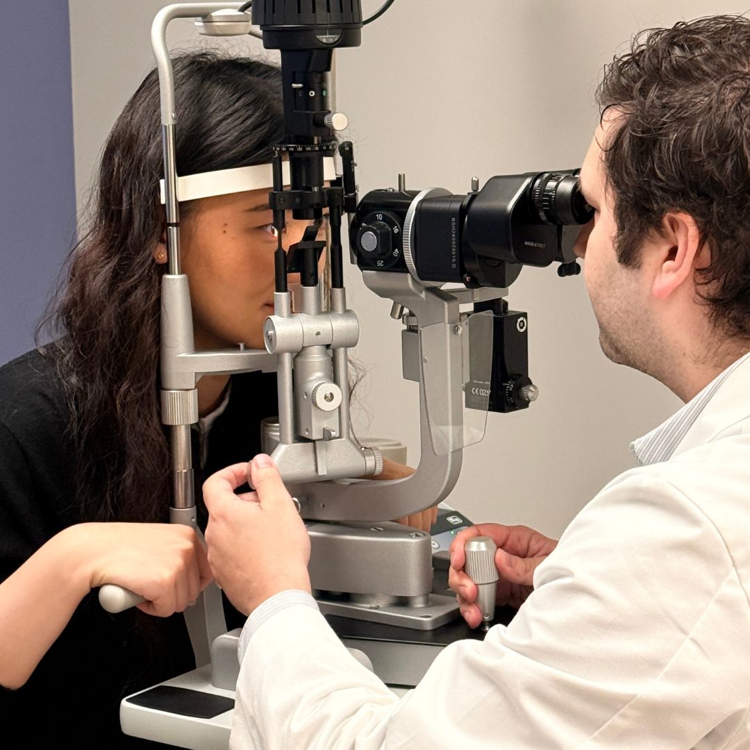 Dr. Brian Ballios examines the vision of a patient.