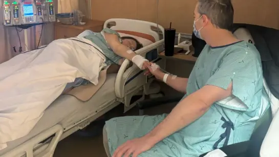 Mike Wise sits next to the beside of his friend receiving an organ donation.
